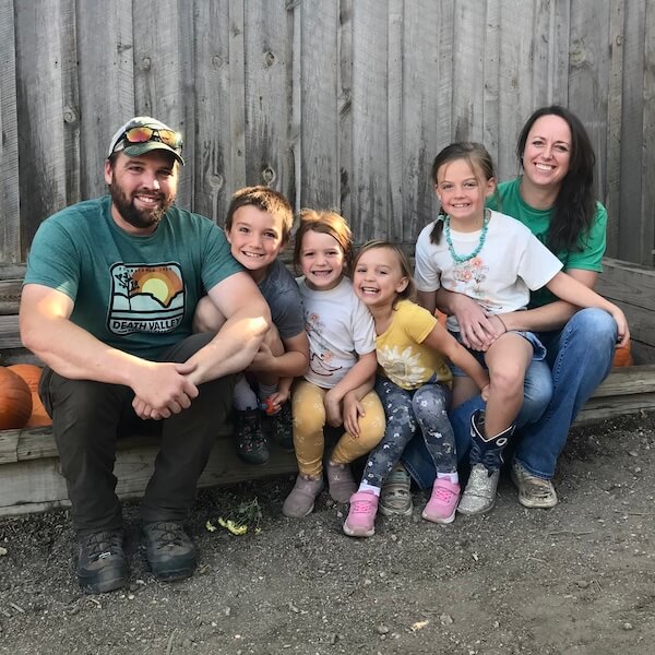 Veterinarian and his family sitting outside